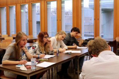 An adjudication panel during a debate - © Tilbury House